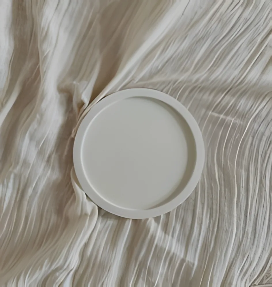 Circle Tray, round concrete tray on linen